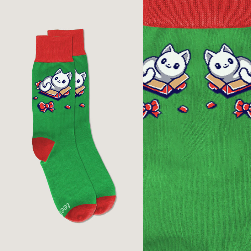 A green The Purrrfect Gift Socks with a white cat and a red bow on it, designed to wear with pride, made by TeeTurtle.