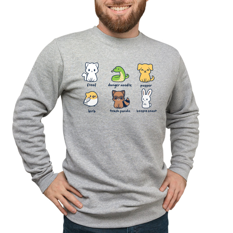 A man wearing a grey sweatshirt with Animal Names by TeeTurtle on it, featuring floofy creatures.