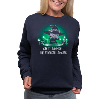 A woman wearing a navy blue sweatshirt with the words "Can't Summon The Strength To Care" exudes strength and defiance. (Brand: TeeTurtle)