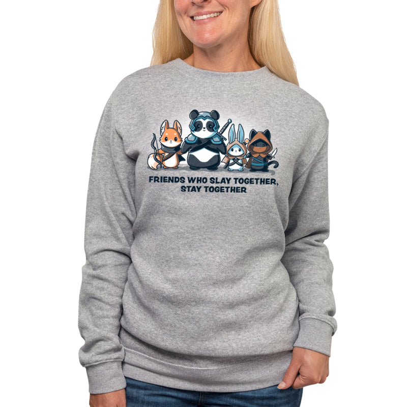 A woman slaying in a "Friends Who Slay Together, Stay Together" sweatshirt from TeeTurtle with cartoon animals.