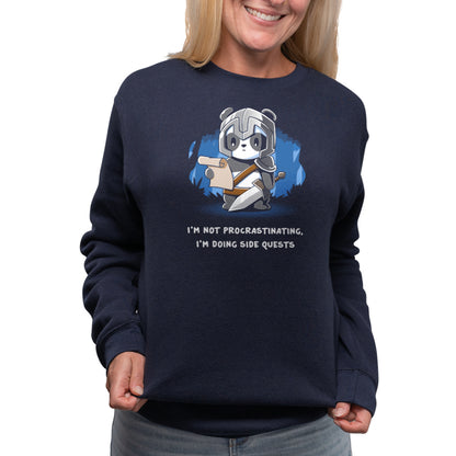 A navy blue women's sweatshirt featuring a bear reading a book by TeeTurtle called "I'm Doing Side Quests".