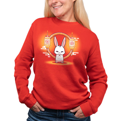 A woman wearing a red sweatshirt with a Teeturtle Lunar New Year Rabbit on it for Lunar New Year.