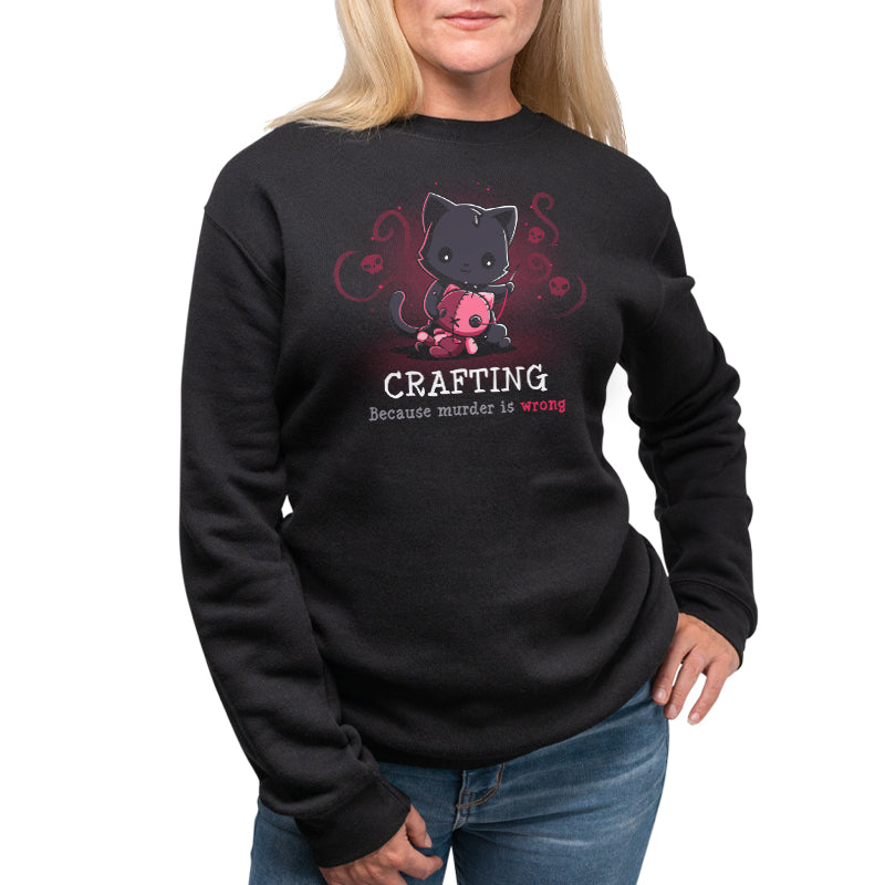A woman wearing a black sweatshirt with "Murder is Wrong" written on it, featuring the TeeTurtle logo.