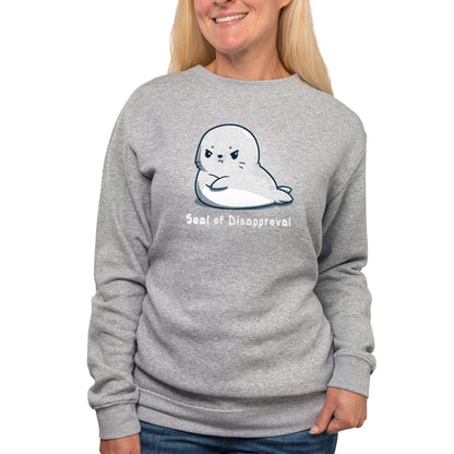 A woman wearing a charcoal gray sweatshirt with the TeeTurtle Seal of Disapproval on it.