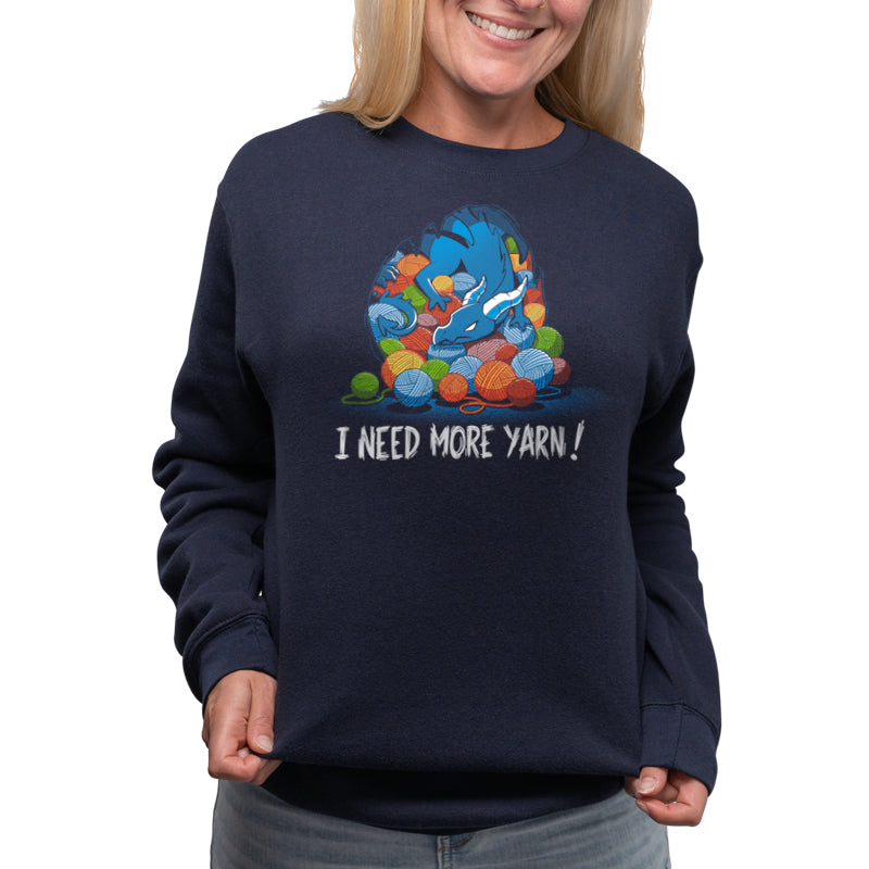 A woman wearing a Yarn Hoarder sweatshirt that says i need more candy. (Brand: TeeTurtle)