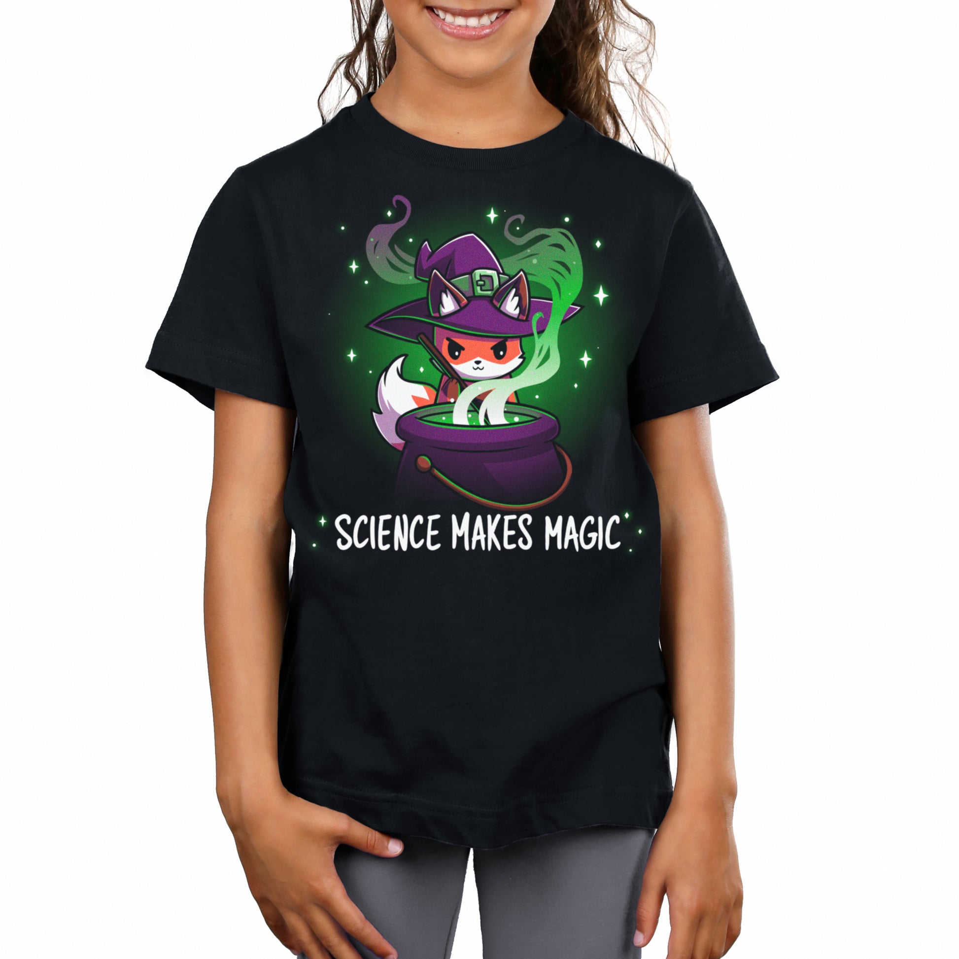 A girl wearing a black t-shirt showcasing the powerful combination of Science Makes Magic by TeeTurtle.