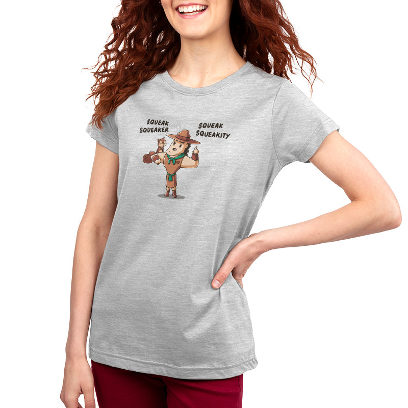 A woman wearing an officially licensed Disney Squeak Squeakity T-shirt with a cartoon character on it.