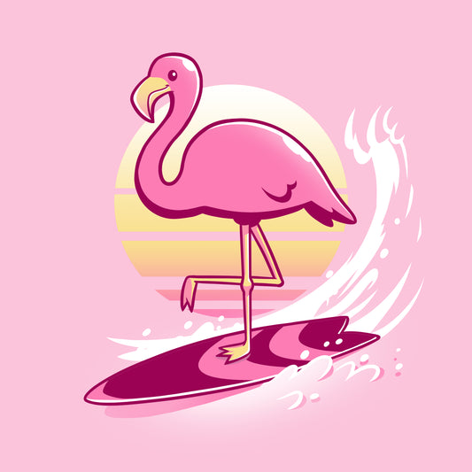 A Surfing Flamingo is riding a surfboard on a pink TeeTurtle t-shirt.