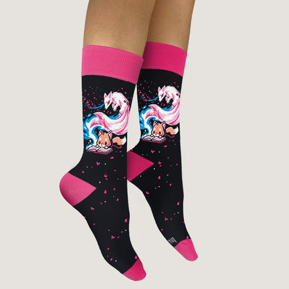 A woman wearing Tale of Tails Socks adorned with unicorns from TeeTurtle.