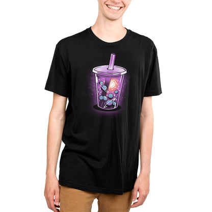 A young man wearing a galaxy-themed t-shirt with the logo of TeeTurtle, a purple drink brand.