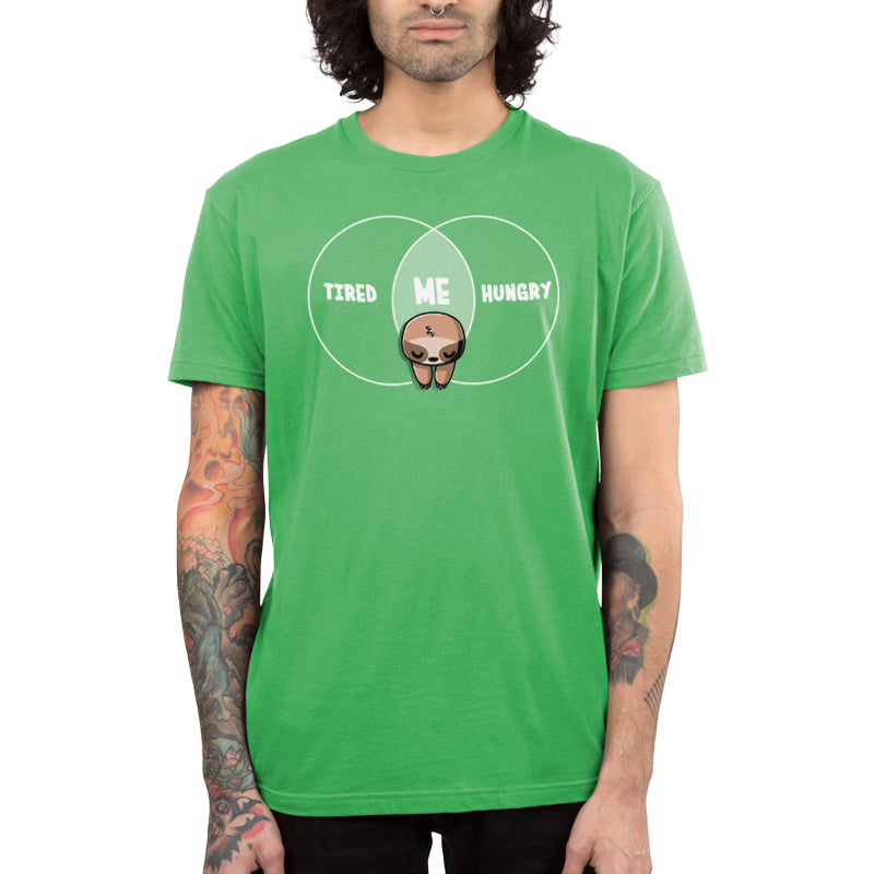 Premium Cotton T-shirt_Teeturtle Tired and Hungry Always apple green t-shirt featuring a cartoon sloth in the middle of a double circle graph with 'Tired' on one side, 'Hungry' on the other and 'Me' in the middle.