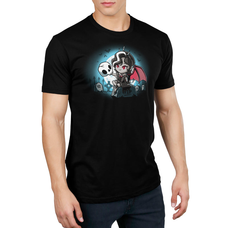 A man wearing a black t-shirt with a TeeTurtle Vampire Princess cartoon character on it.