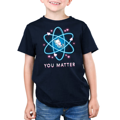 A young boy wearing a navy blue TeeTurtle t-shirt that says "You Matter".