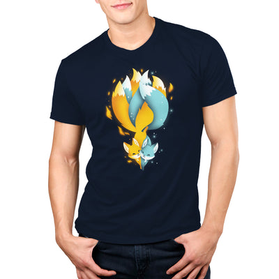 Premium Cotton T-shirt_TeeTurtle Tails of Fire and Ice navy blue apparel featuring an orange and blue kitsune with their tails interlocked with flames and ice sparkles surrounding them.