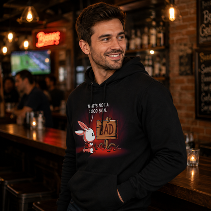 Pullover Hoodie_TeeTurtle That's Not a Good Sign black design featuring an adventurous bunny looking at a wooden sign with the word "bad" on it.