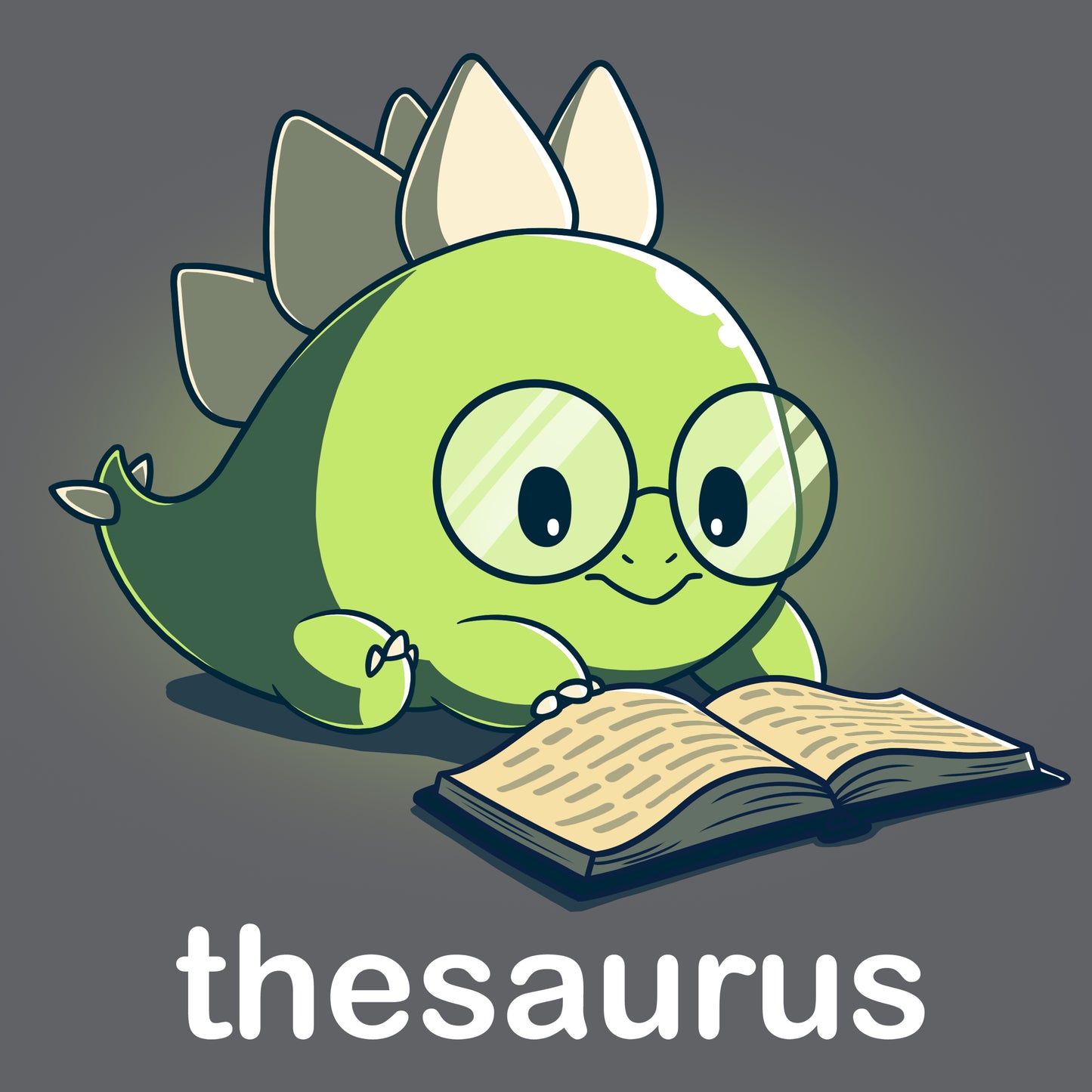 A fun cartoon dinosaur reading a book on a TeeTurtle Thesaurus T-shirt.