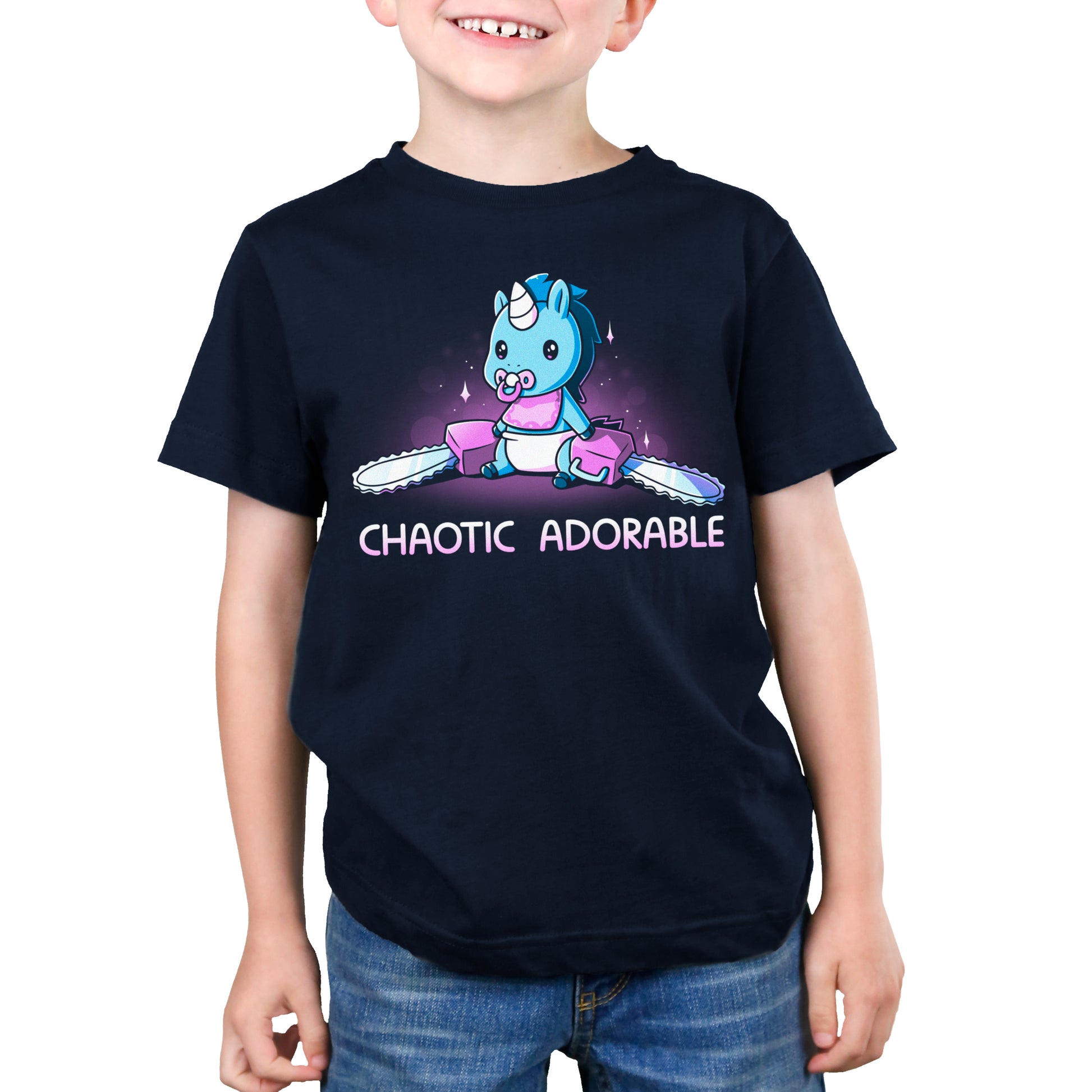 A boy wearing a navy blue t-shirt that says TeeTurtle Chaotic Adorable.