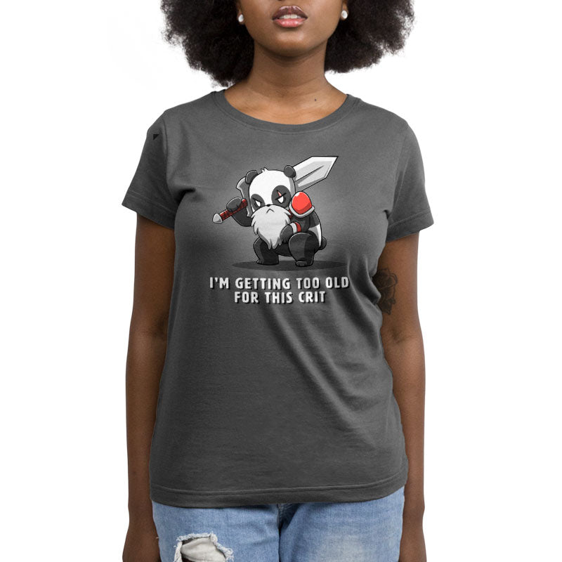 A woman wearing a "I'm Getting Too Old For This Crit" t-shirt from TeeTurtle.