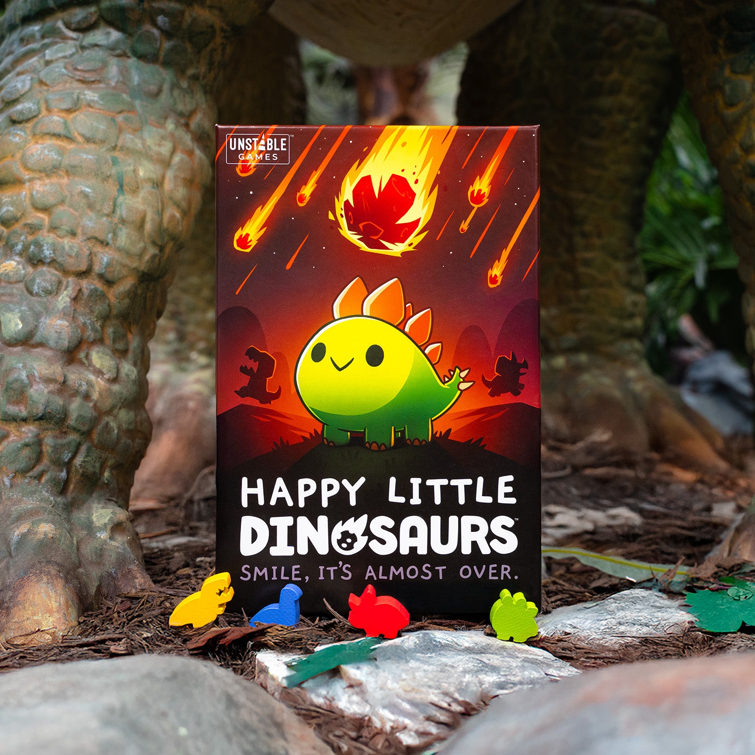 Happy Little Dinosaurs: Base Game in a jungle, with gigantic dinosaur legs in the background