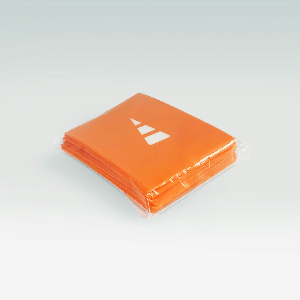 Unstable Games' Orange Card Sleeves showcase a vibrant orange with a sleek white geometric design, neatly wrapped in clear plastic. Enhance your gaming setup with these sleeves that bring Unstable Games' dynamic flair to every session.