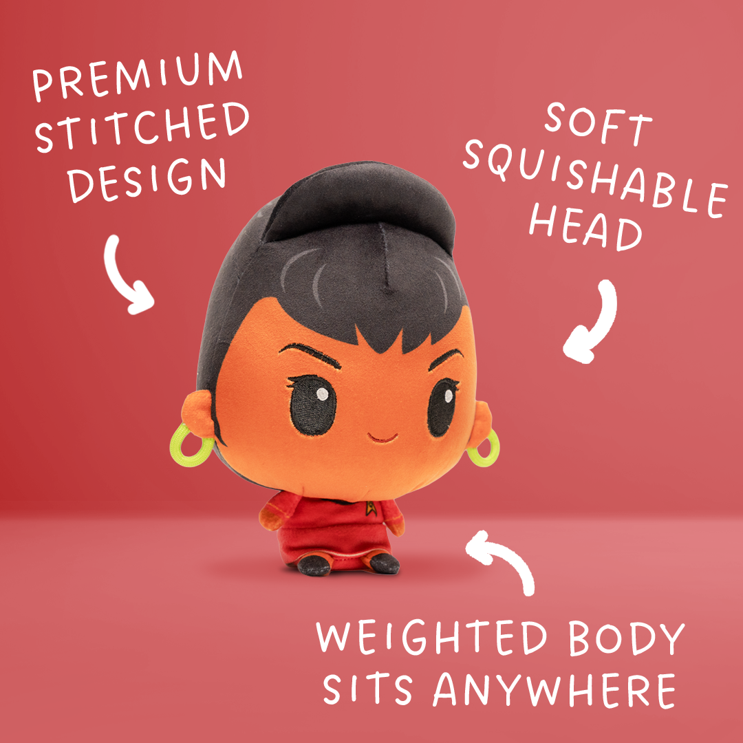 Front view of an Uhura plush with dark hair in a high bun, gold hoop earrings, a red Starfleet uniform, and a small weighted body.