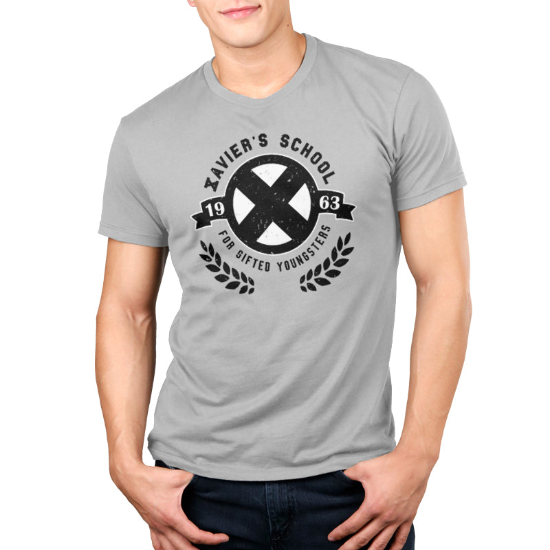 A man wearing a grey t-shirt with the Marvel - Deadpool/X-Men logo on it, representing his pride as a mutant alumnus from Xavier's School for Gifted Youngsters.