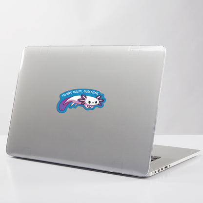 A water-resistant laptop with a unicorn image on it, perfect for customization with TeeTurtle's You Sure Axolotl Questions Sticker.