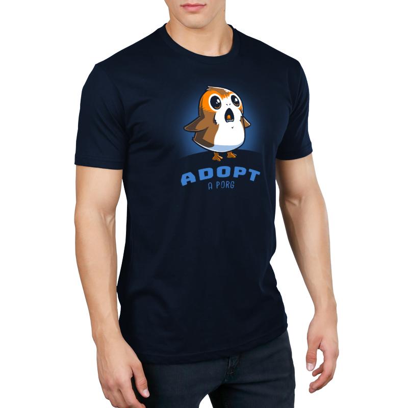 A man wearing an officially licensed Star Wars Adopt a Porg T-shirt.