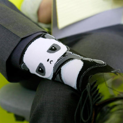 A Grumpy Panda Sock playing on a person's feet. (Brand: TeeTurtle)