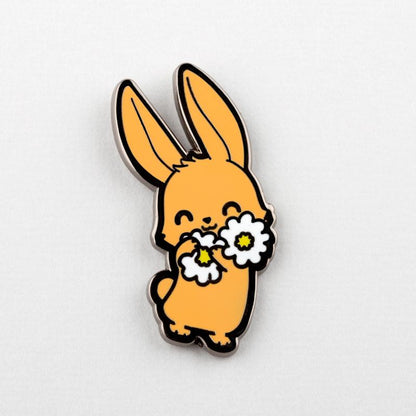 A TeeTurtle Bunny With Flowers Pin with flowers on its head.