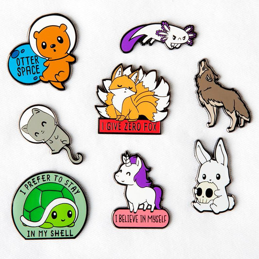 A collection of TeeTurtle Howl at the Moon enamel pins with different dimensions.