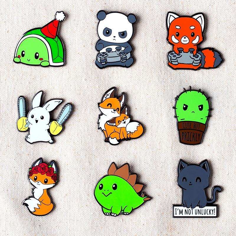 A collection of Pew Pew Panda Pins by TeeTurtle featuring animals with tiny paws.