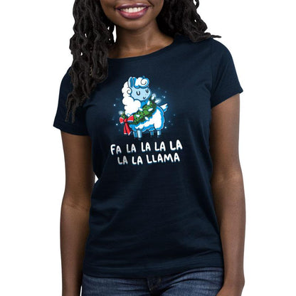 A woman wearing a navy blue t-shirt with a TeeTurtle Christmas Llama print that says "i'll be a llama la christmas.