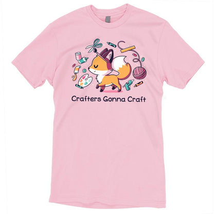 Teeturtle Pink Crafters Gonna Craft Premium Cotton T-shirt. Featuring a little fox surrounded by scissors, a paintbrush, yarn, a glue gun and various other crafting items.