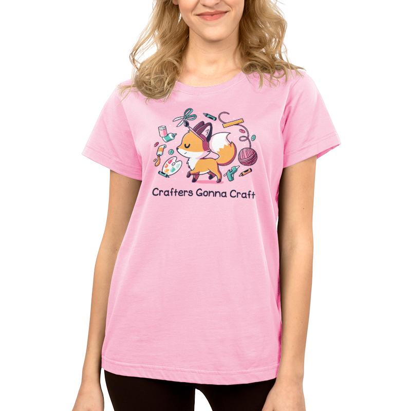 Teeturtle Pink Crafters Gonna Craft Premium Cotton T-shirt. Featuring a little fox surrounded by scissors, a paintbrush, yarn, a glue gun and various other crafting items.