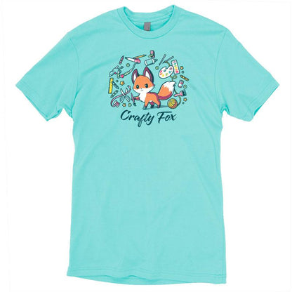 Premium Cotton T-shirt_TeeTurtle Crafty Fox caribbean blue t-shirt featuring a cute fox holding a brush in its forepaw and surrounded by yarn, scissors, ribbon, paint and many other crafting items.