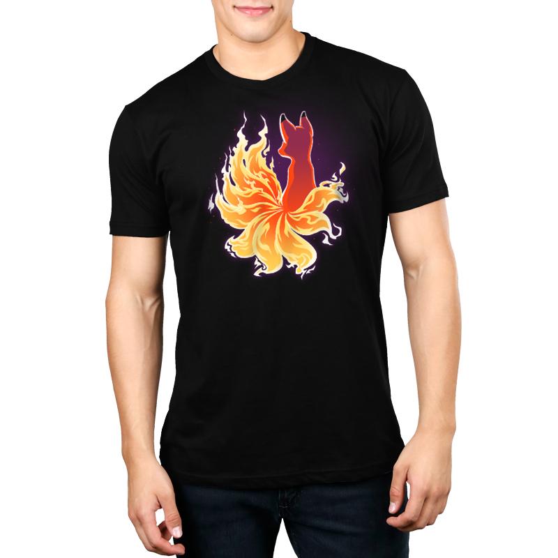 A man wearing a black t-shirt with a Fire Kitsune from TeeTurtle on it, exuding comfort and fit.