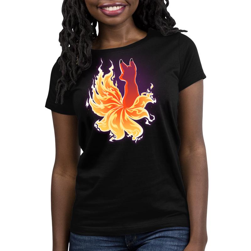 A women's black Fire Kitsune T-shirt by TeeTurtle with an image of a fire fox.