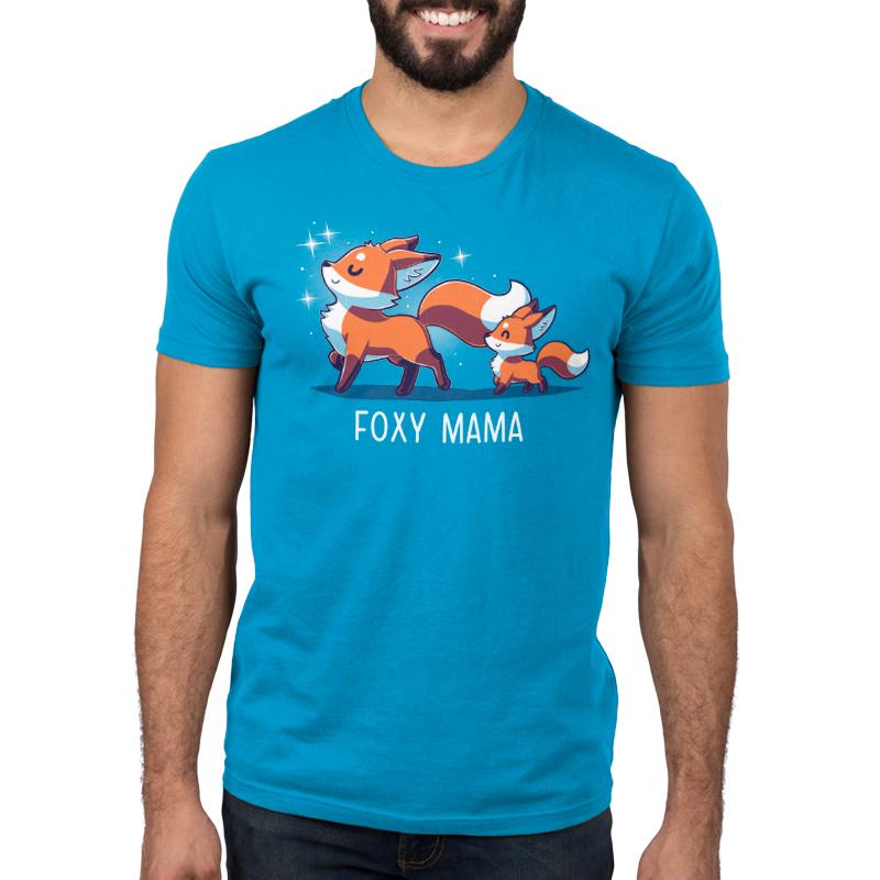 A man wearing a cobalt blue t-shirt that says TeeTurtle Foxy Mama.