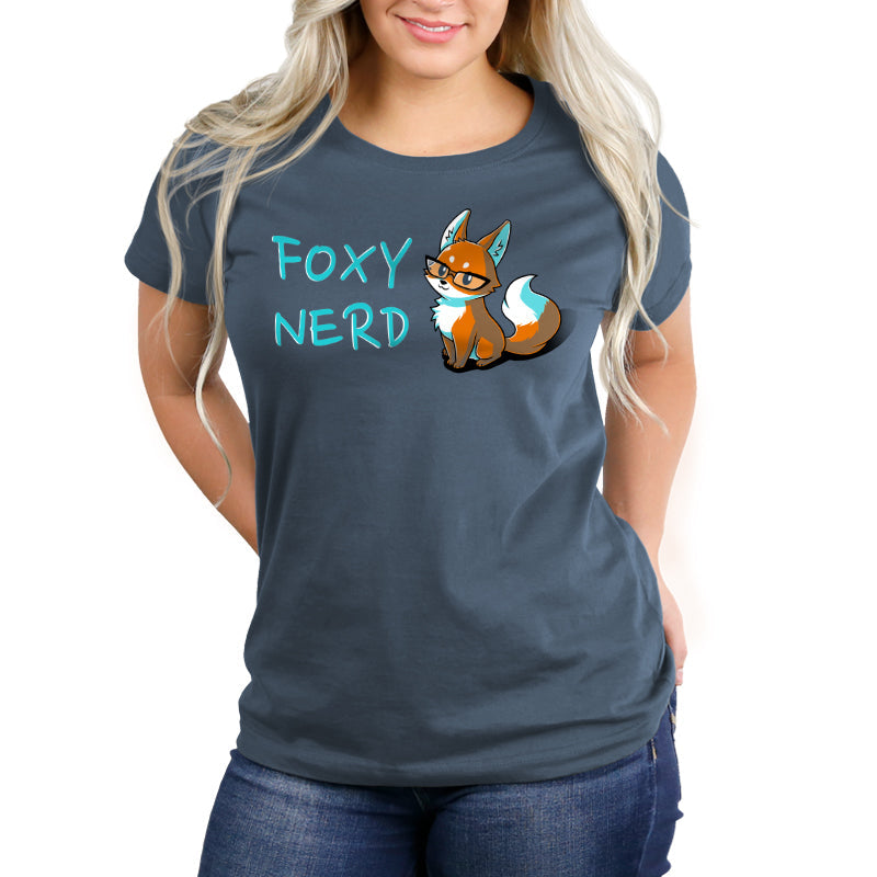 Person wearing an indigo t-shirt made from super soft ringspun cotton, featuring a cartoon fox wearing glasses and the text "Foxy Nerd" printed on it from monsterdigital.