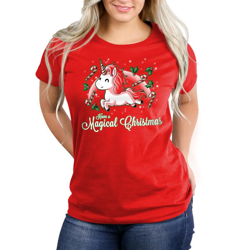 A woman wearing a red t-shirt with a unicorn on it provided by TeeTurtle was wearing the "Have a Magical Christmas" tee.