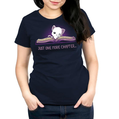 A navy blue women's t-shirt with a cat holding a book and the phrase "Just One More Chapter" by TeeTurtle.