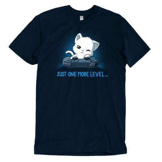 Premium Cotton T-shirt_TeeTurtle Just One More Level navy blue t-shirt featuring a cat falling asleep in front of a video game controller.