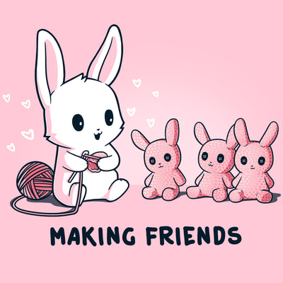 Premium Cotton T-shirt_Teeturtle light pink Making Friends apparel featuring a white bunny knitting 3 bunny friends out pink of yarn, caption reads, "Making Friends'.