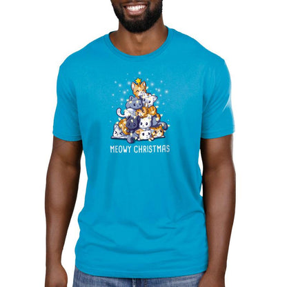 A man wearing a cobalt blue t-shirt that says Meowy Christmas by TeeTurtle.