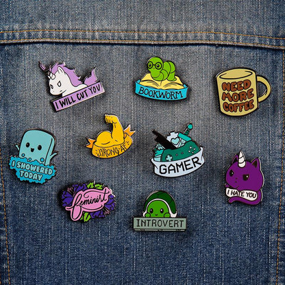 A collection of TeeTurtle's I Showered Today Pins on a denim jacket, celebrating life's small victories.