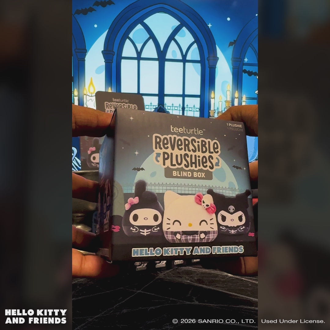 An unboxing video of the Hello Kitty and Friends Haunted House Reversible Plushie Blind Box, showing the Hello Kitty plushie being unboxed and flipped from Halloween plaid to skeleton form.