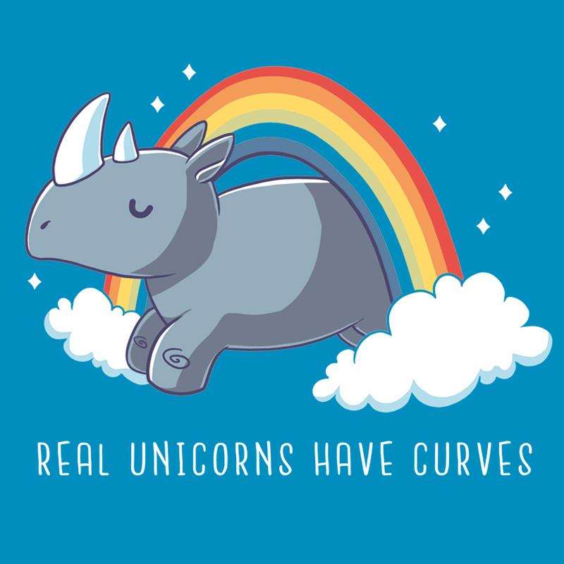 Illustration of a rhinoceros with a rainbow and clouds in the background on a cobalt blue t-shirt, accompanied by the caption "Real Unicorns Have Curves" in white text. Made from super soft ringspun cotton for ultimate comfort. This product is called Real Unicorns Have Curves by monsterdigital.