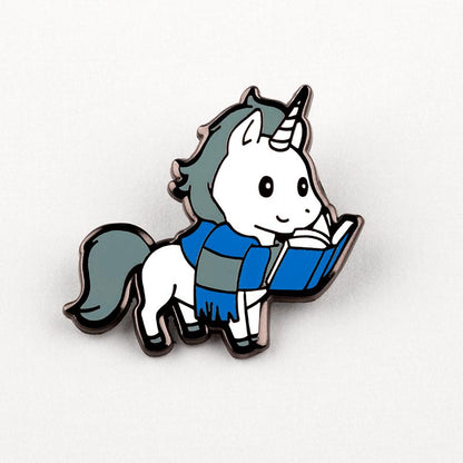 A Smart Unicorn Pin by TeeTurtle reading a book.