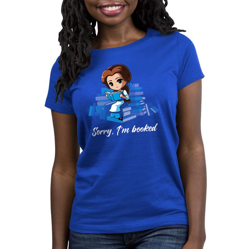 A woman wearing a Disney Sorry, I'm Booked (Belle) blue t-shirt that says i'm a nerd.